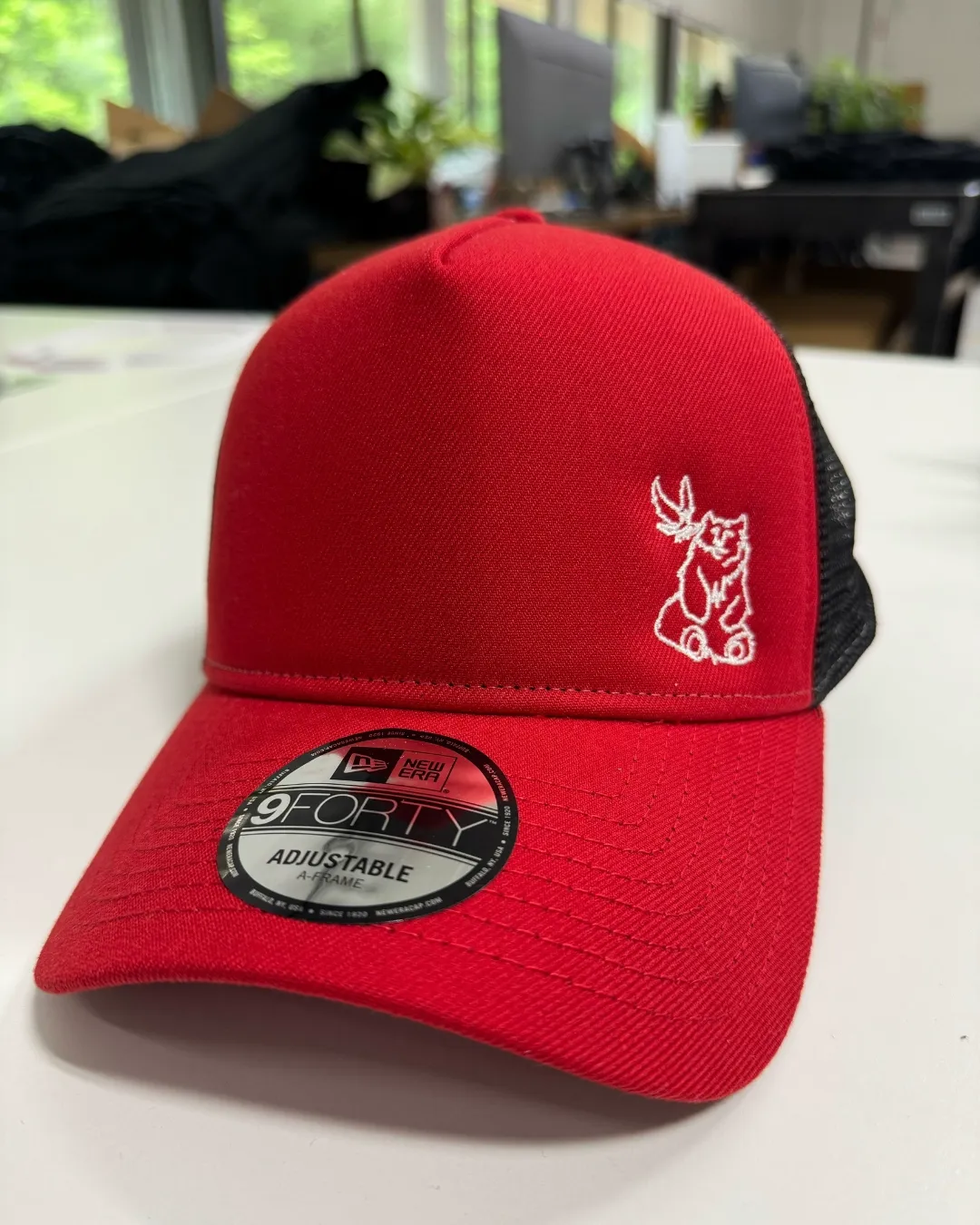 Three custom hats made for Bird and Bear Collective featuring embroidery and a patch design